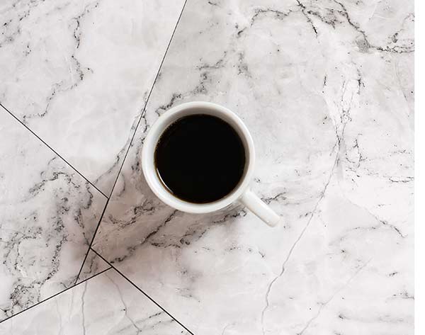 a-cup-of-black-coffee-on-a-marble-tile-pause-at-w-2022-05-25-09-24-08-utc